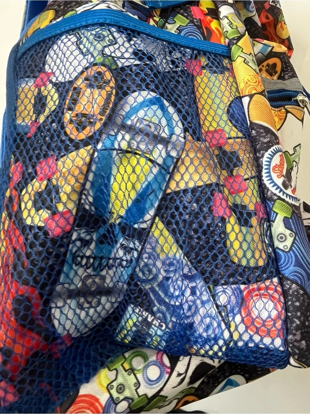 This Reboot Kids Blue Multi-Print Backpack - Fun Skateboard Pattern